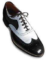 Black and white spectator wingtip lace up dress shoes